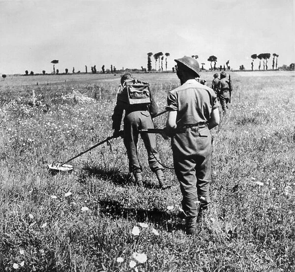 British army soldiers at work searching for enemy mines during the push in to France