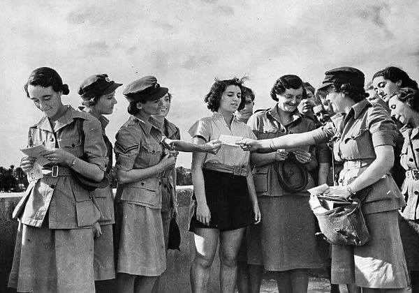 British ATS women in the Middle East, getting letters from home. November 1942