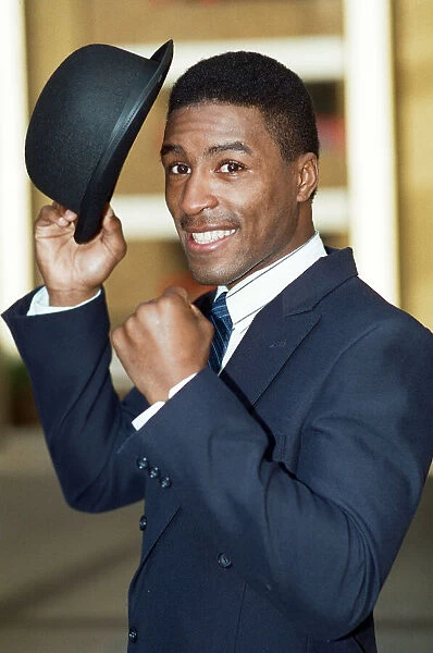 British boxer Michael Watson posing in suite and top hat ahead of his WBA title fight