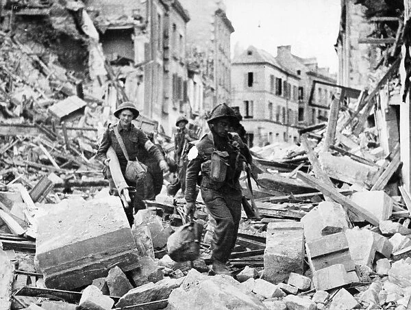 British and Canadian troops captured the city of Caen in Northern France after a massive