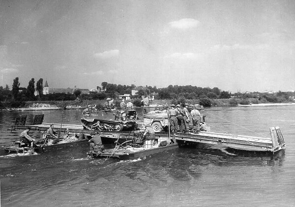 British and Canadian troops crossing the River Seine at Elbeuf in Normandy
