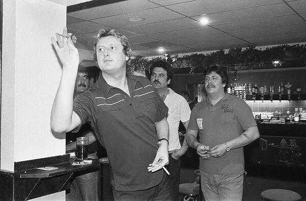 British dart player Eric Bristow pictured at the pubb, enjoying a friendly game with