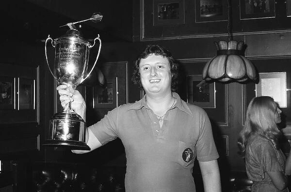 British darts player Eric Bristow celebrates his victory over John Lowe in the Final of