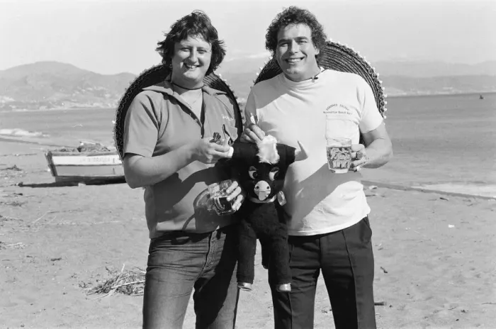 Framed Print : British darts player Eric Bristow poses on the beach with Bobby George at Torremolinos Framed Print : British darts player Eric Bristow poses on the beach with Bobby George at Torremolinos