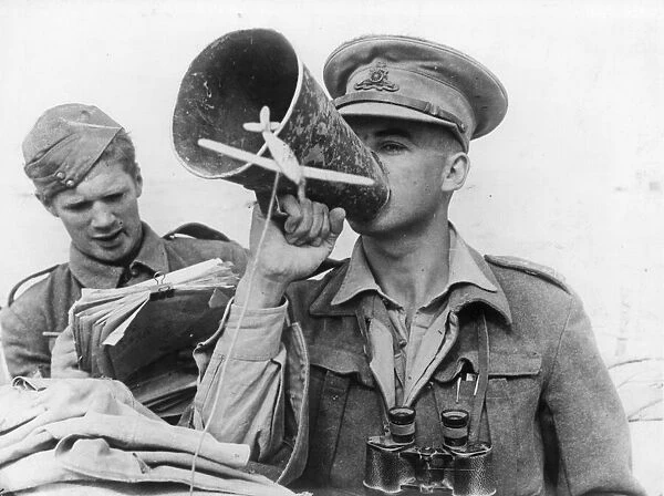 British field artillery in action in Tobruk: Captain John Hay of Edinburgh giving orders