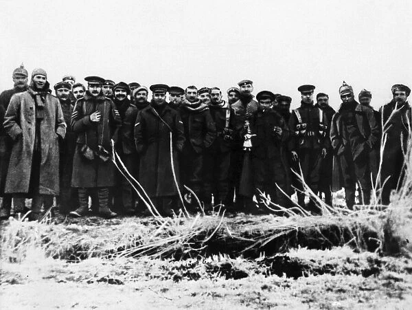 British and German troops hold a temporary truce on Christmas Day 1914 during