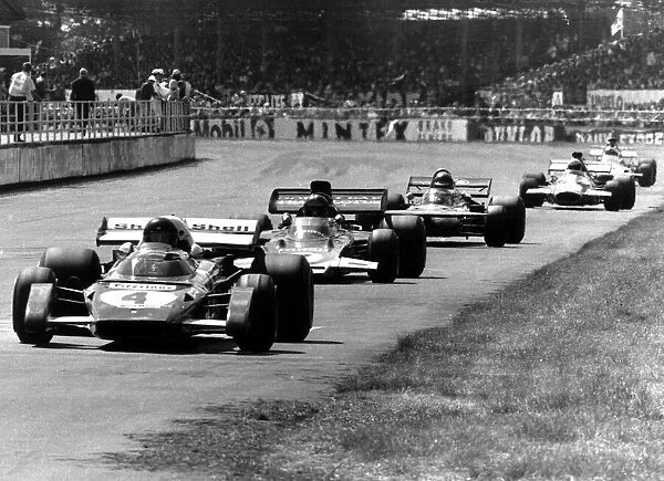 British Grand Prix Silverstone Jacky Ickx in the Ferrari number 4 car leads Emerson