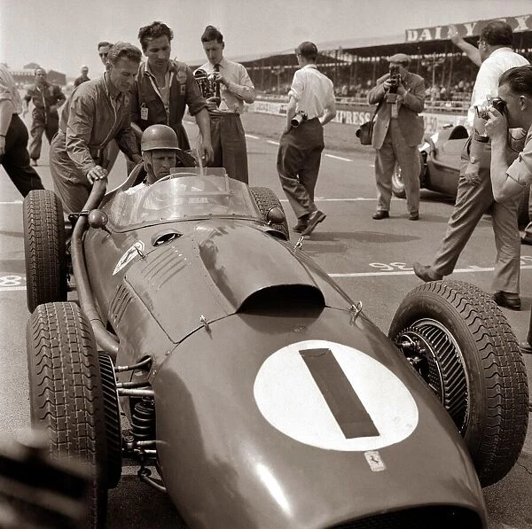 British Grand Prix Silverstone July 1958. Peter Collins sits in his Ferrari Dino