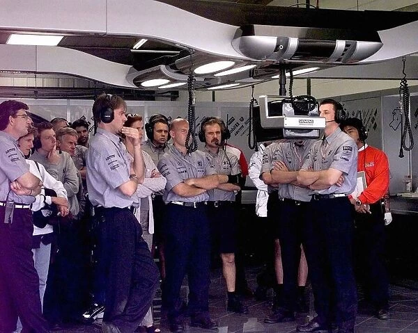 British Grand Prix at Silverstone Qualifying Session. the McLaren Pit Crew watch