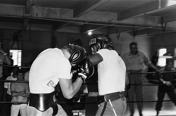 British heavyweight boxer Joe Bugner (left) sparring with Emile Griffith in a gym in New