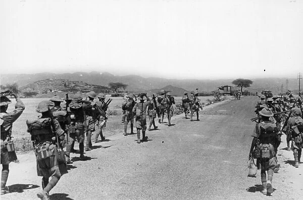 British and Indian army soldiers on the frontline marching forwards towards t the Battle