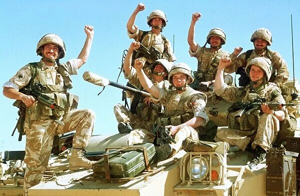 British infantrymen celebrate on a Warrior Armoured Personnel Carrier during the Gulf