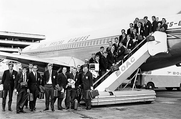 The British Lions rugby union team pose on the steps of their plane before leaving for