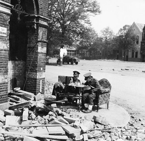 British Military Police sit in comfort while checking convoys across the bridge at Arnhem
