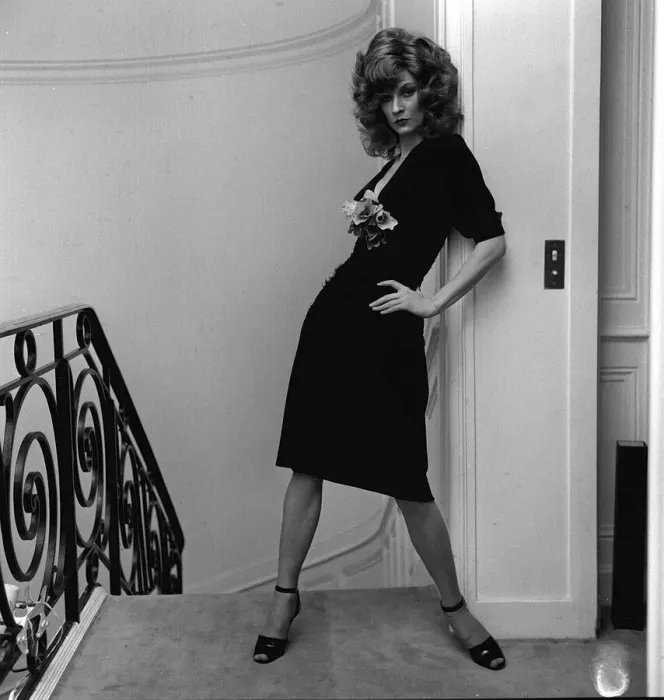 Framed Print : British model Vicki Hodge wearing black clingy dress with plunging neck line with posy Framed Print : British model Vicki Hodge wearing black clingy dress with plunging neck line with posy