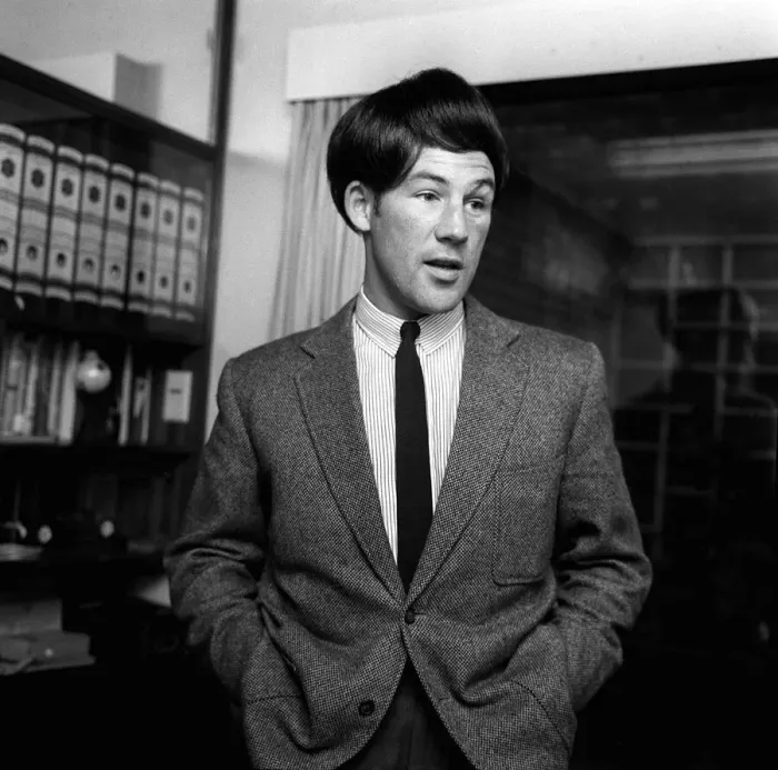 Framed Print : British motor racing driver Stirling Moss wearing a Beatles wig, November 1963 Framed Print : British motor racing driver Stirling Moss wearing a Beatles wig, November 1963
