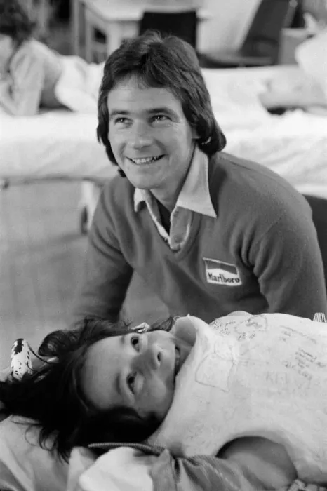 Framed Print : British Motorcycle road racer Barry Sheene with young fan Tony Vickers who is undergoing Framed Print : British Motorcycle road racer Barry Sheene with young fan Tony Vickers who is undergoing