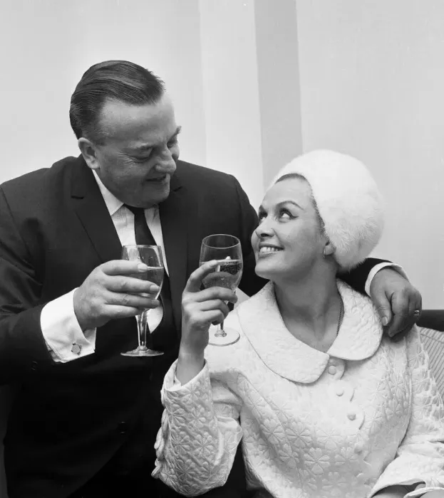 Framed Print : British musician Ronnie Ronalde toasts his new bride Yana after their wedding ceremony Framed Print : British musician Ronnie Ronalde toasts his new bride Yana after their wedding ceremony