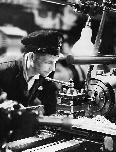 British Naval Factory a Float. Typical young E. R. A at work in the light machine