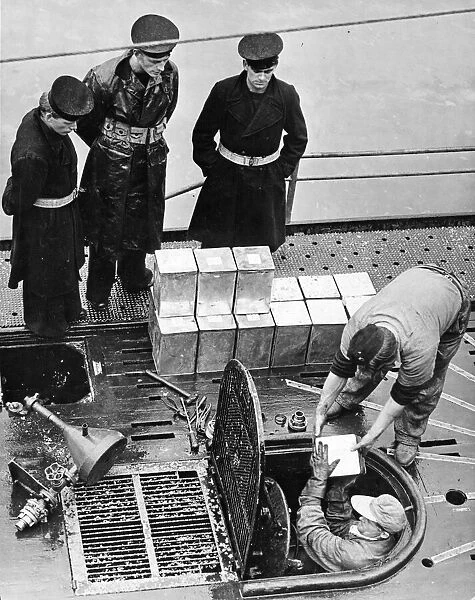 British naval ratings watching the crew of the surrendered submarine U532 berthed in