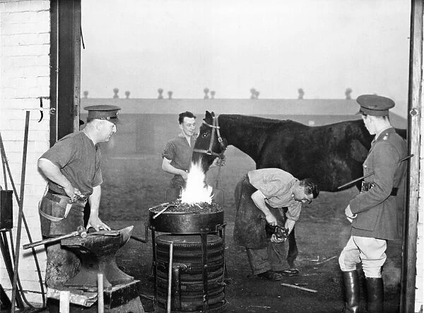 A British officer (right) is pictured at a stables in The Hull