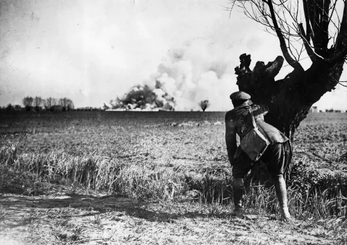 Framed Print : British official observes from a distance the destruction of an amminition dump beforev