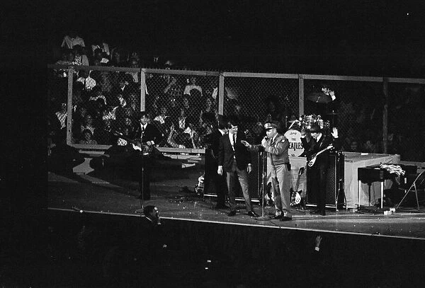 British pop group The Beatles performing on stage at the Cow Palace in San Francisco