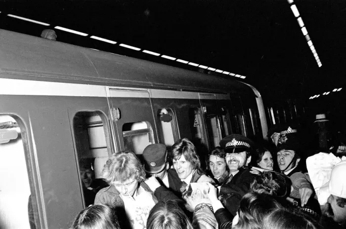 Framed Print : British pop singer David Boowie greeted by crowds of fans at Charing Cross Station Framed Print : British pop singer David Boowie greeted by crowds of fans at Charing Cross Station
