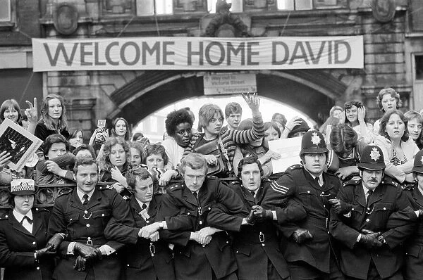 British pop singer David Bowie arrives home at Victoria Station