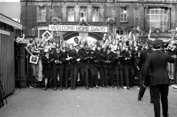 Framed Print : British pop singer David Bowie arrives home at Victoria Station