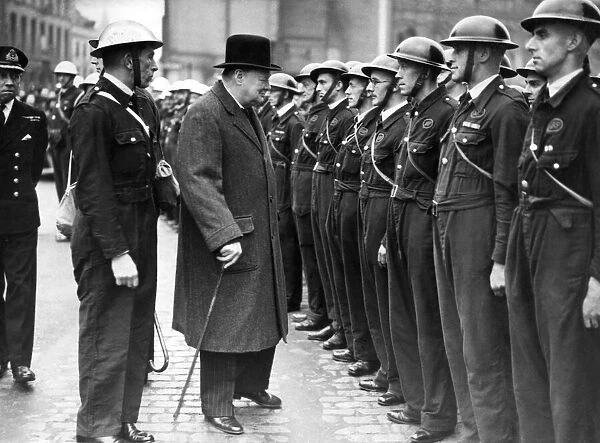 The British Prime Minister, Mr. Winston Churchill, is inspecting members of Coventry