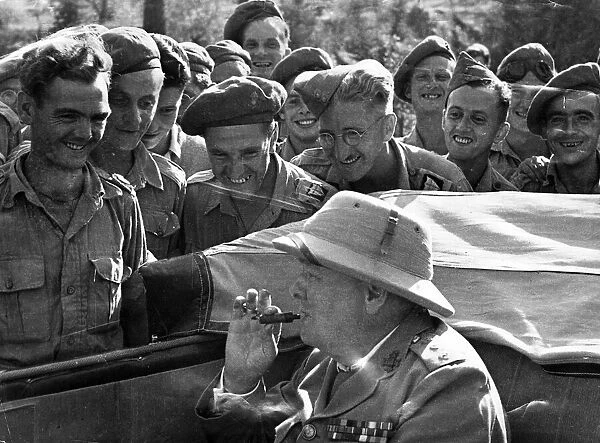 British Prime Minister Winston Churchill lsurrounded by British troops during a vist to