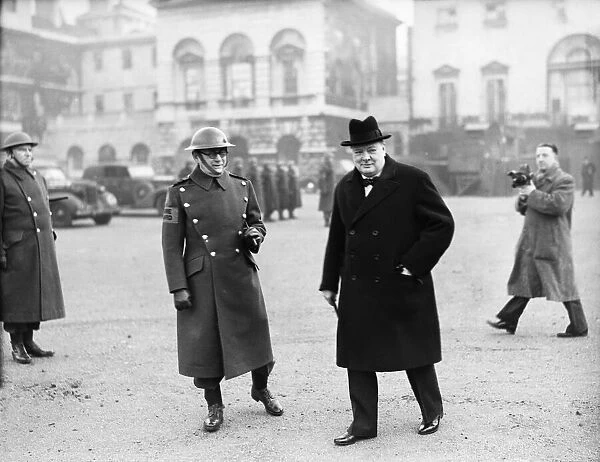 British Prime Minister Winston Churchill, accompanied by his wife Lady Churchill