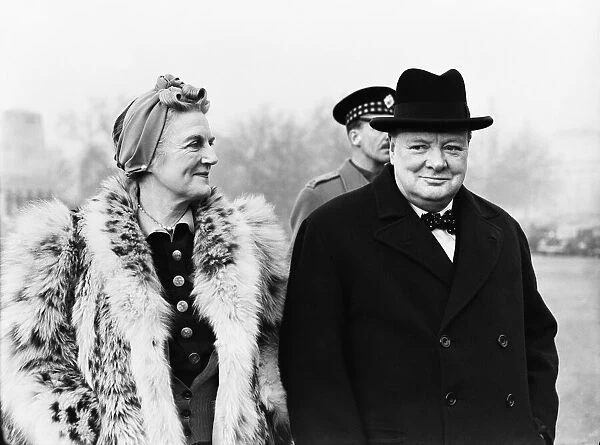 British Prime Minister Winston Churchill, accompanied by his wife Lady Churchill