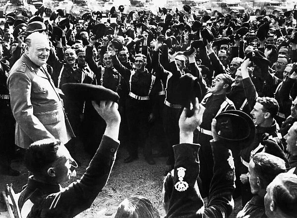 British Prime Minister Winston Churchill is cheered by men of the 4th Hussars after his