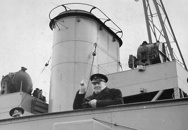 British prime Minister Winston Churchill gives the famous V for victory sign on board a