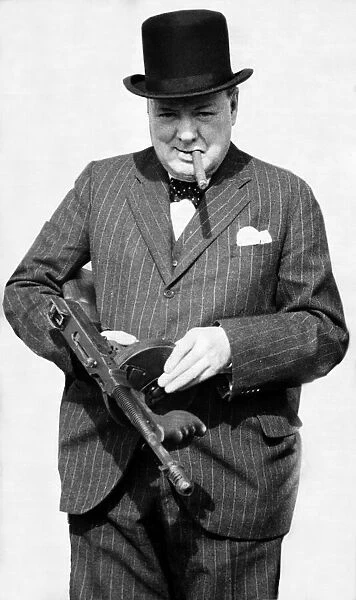 British Prime Minister Winston Churchill holding a Thompson submachine gun whilst smoking