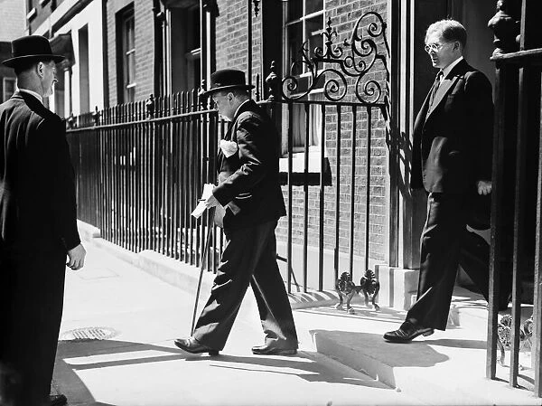 British Prime Minister Winston Churchill leaving Number 10 Downing Street for the House