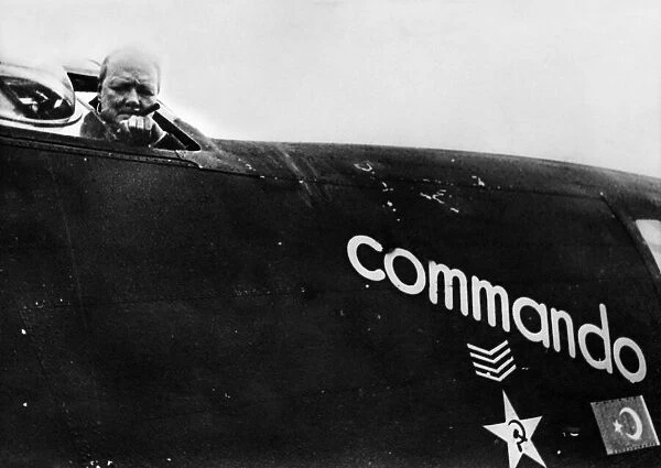 British Prime Minister Winston Churchill looks out from his personal aircraft