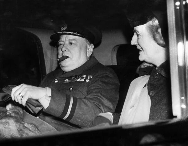 British Prime Minister Winston Churchill with his wife Lady Churchill leaving Paddington