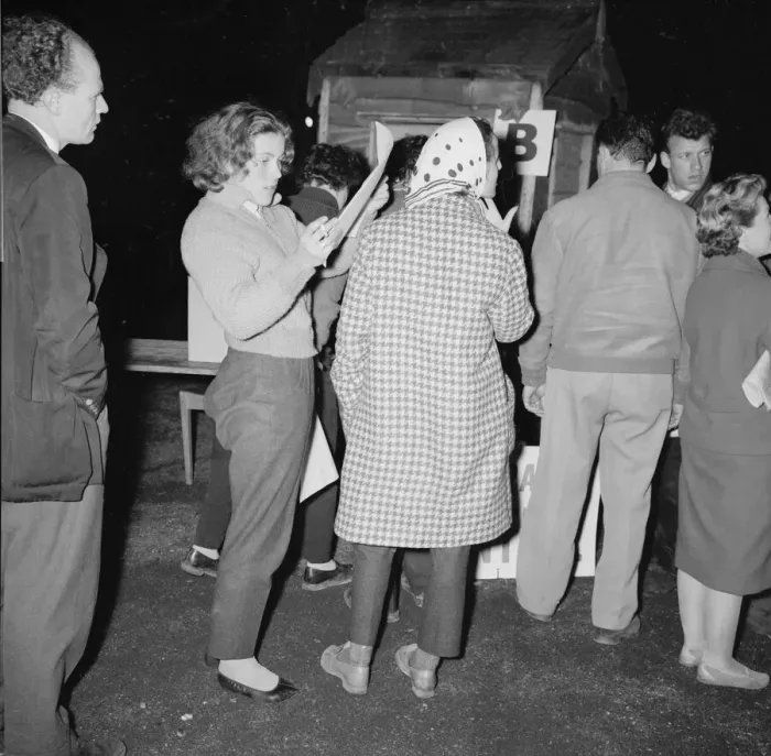 Framed Print : British racing drivers Pat Moss and Ann Wisdom check in looking tired after finishing