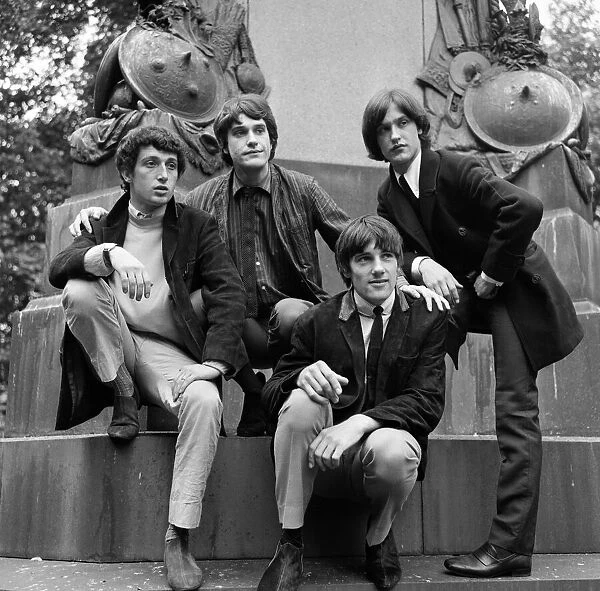 British rock group The Kinks pose on horses in the gardens opposite the Flaghouse in