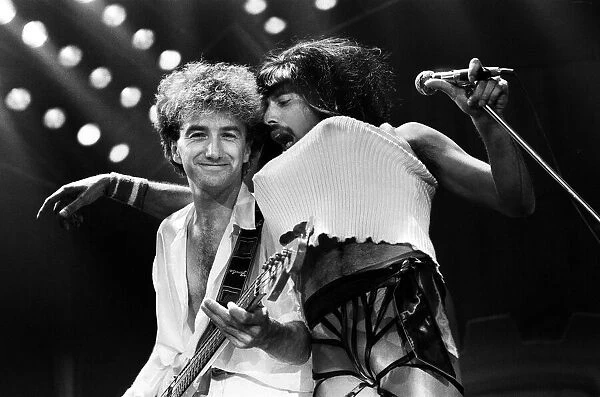 British Rock group Queen in concert at Wembley Arena. Singer Freddie Mercury in