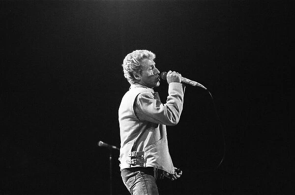 British rock group The Who, performing on stage at the NEC in Birmingham. Roger Daltrey