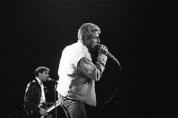 British rock group The Who, performing on stage at the NEC in Birmingham. Roger Daltrey