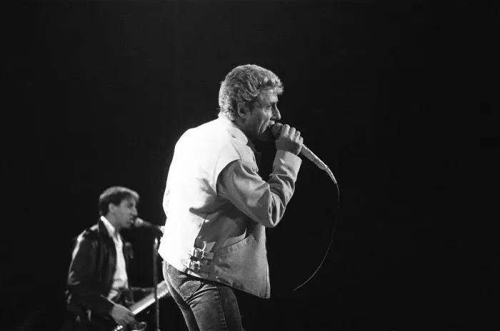 Framed Print : British rock group The Who, performing on stage at the NEC in Birmingham. Roger Daltrey