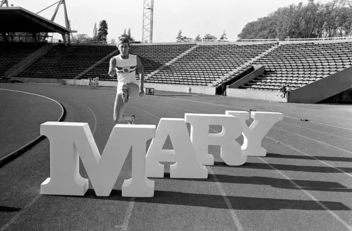 Framed Print : British runner Mary Rand poses during a photoshoot on the race track