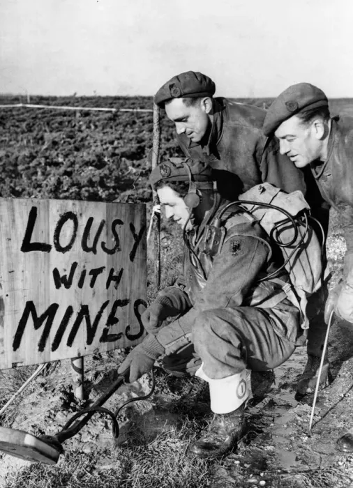 Framed Print : British sappers at work clearing away enemy mines in a field near the town of Framed Print : British sappers at work clearing away enemy mines in a field near the town of