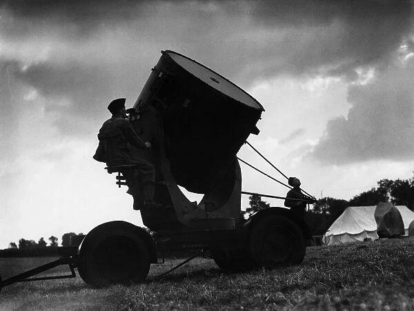 A British searchlight crew in action during an air raid training exercise
