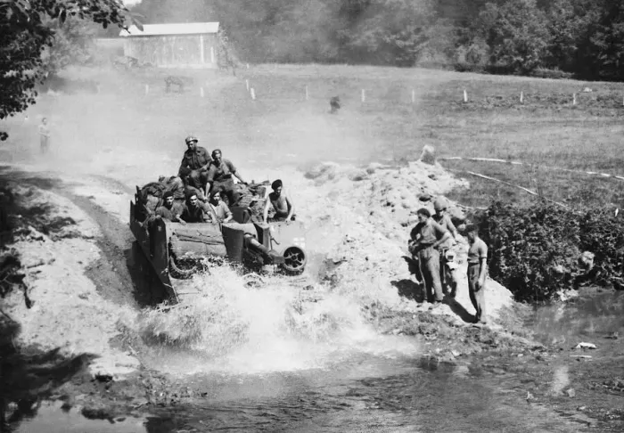 Framed Print : A British Self Propelled gun plunges through a stream in pursuit of the German 7th army
